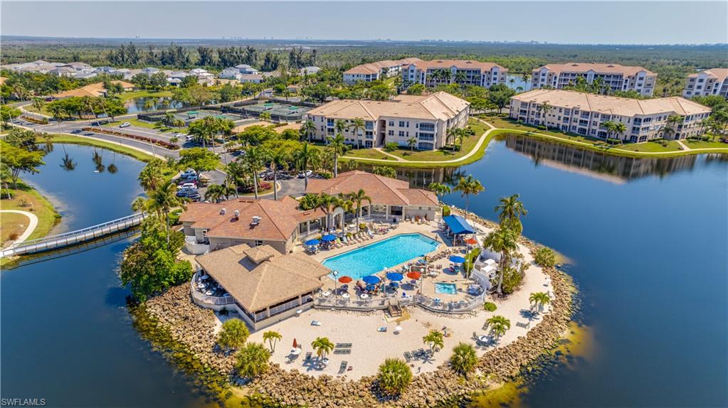 Drone / aerial view of a pool and a large body of water