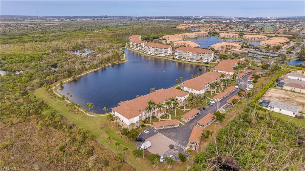 Bird's eye view featuring a water view and a residential view
