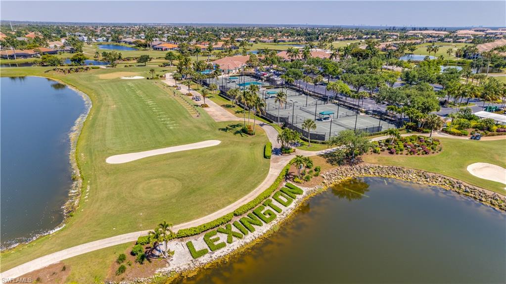 View of property location featuring a nearby body of water and nearby suburban area