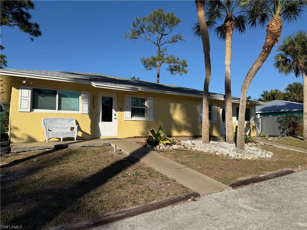 Single story home featuring stucco siding