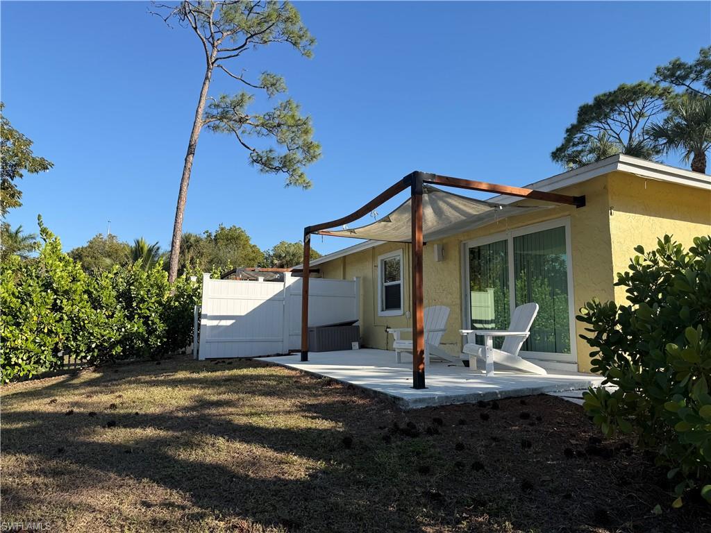 Back of property featuring a patio and stucco siding