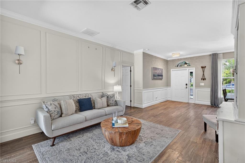 Formal Living Room with Floor to Ceiling Wood Paneling