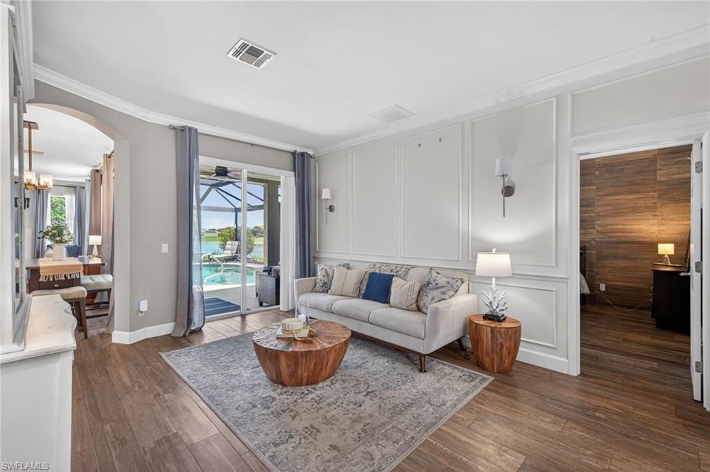 Formal Living Room with Crown Molding & Sliders