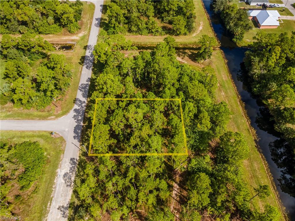 View of property location with a large body of water and property parcel outlined
