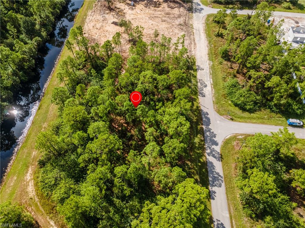 Aerial overview of property's location with a nearby body of water