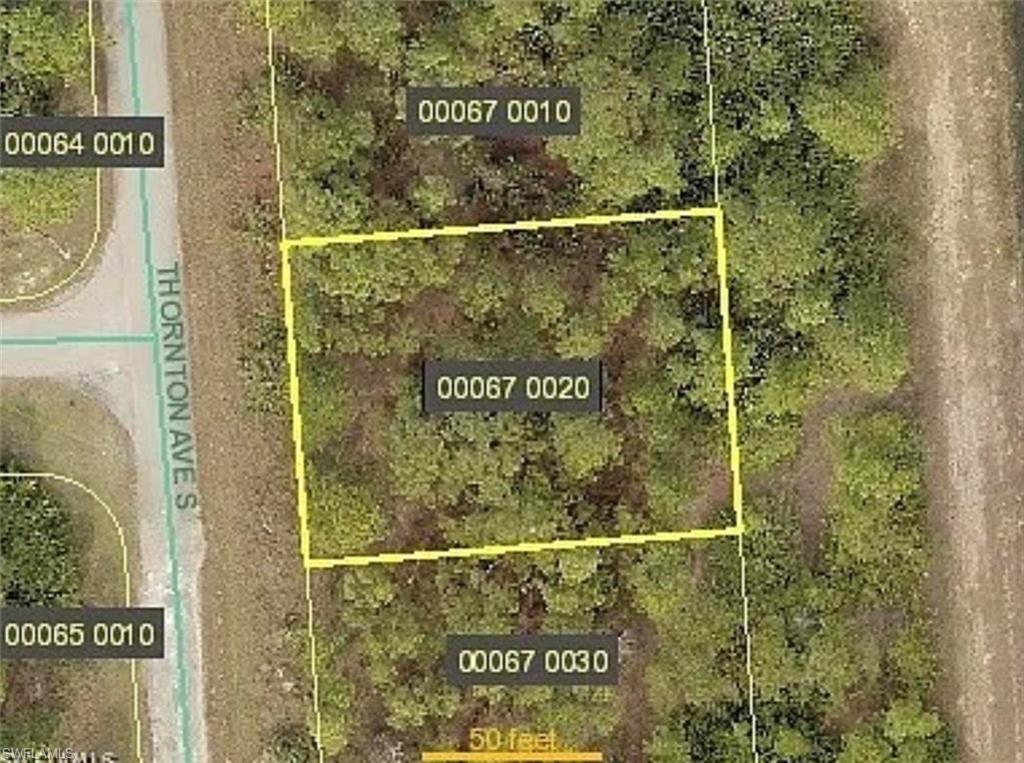 Aerial map of property and surrounding area featuring property boundaries highlighted