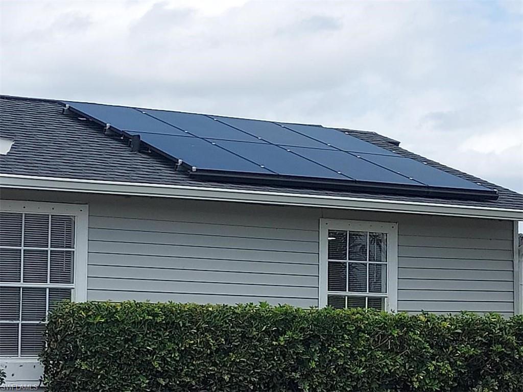 Gable roof with dark shingles and solar panels