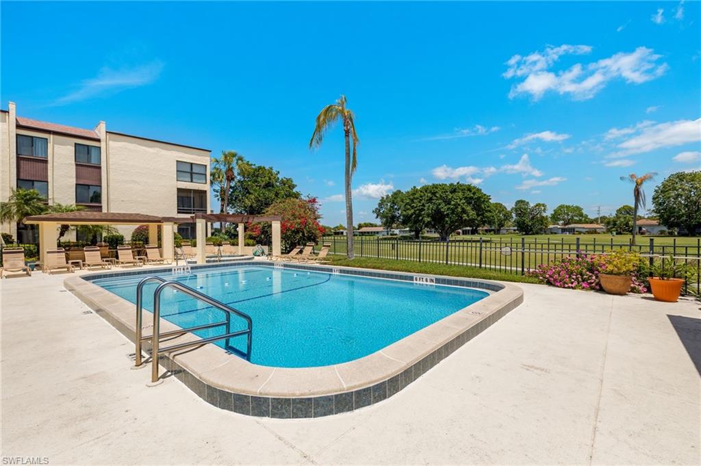 View of pool with a pergola