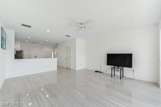 Living Room with ceiling fan, recessed lighting, and light wood-style floors