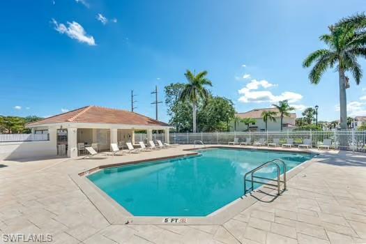 Community pool featuring a patio area