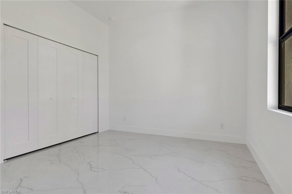 Guest bedroom 2 with view of closet