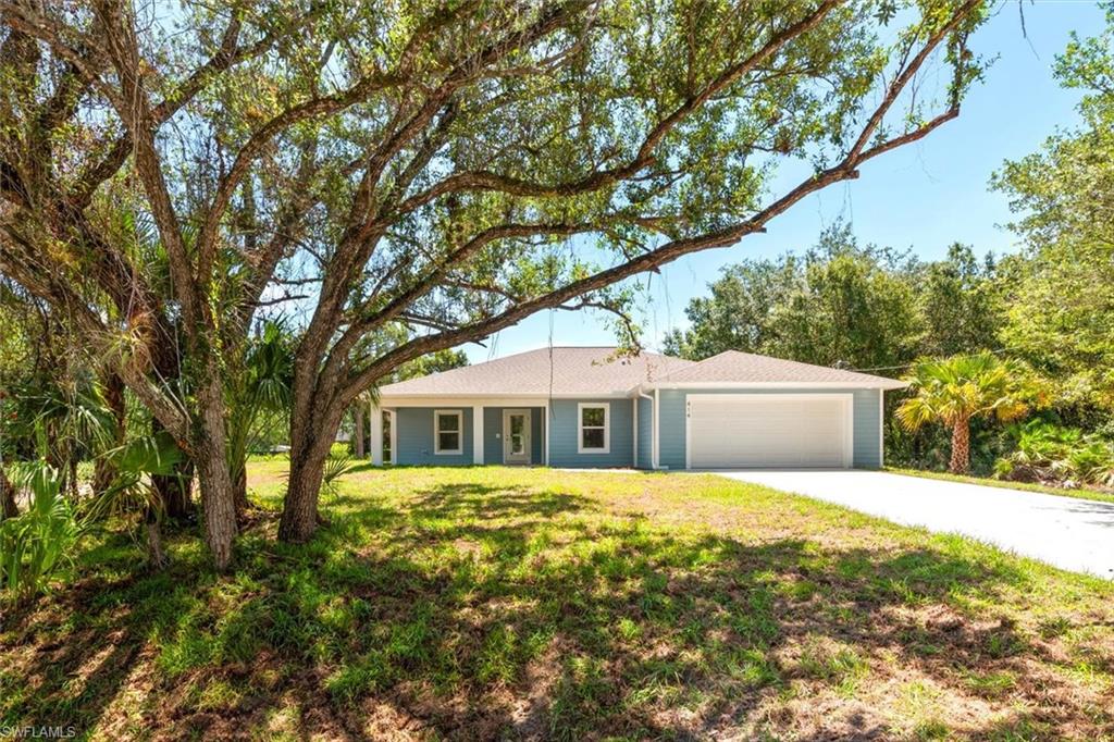 Welcome to 414 Cleveland Ave in Lehigh Acres. You will love the spared oak trees in the front that provide some great shade.