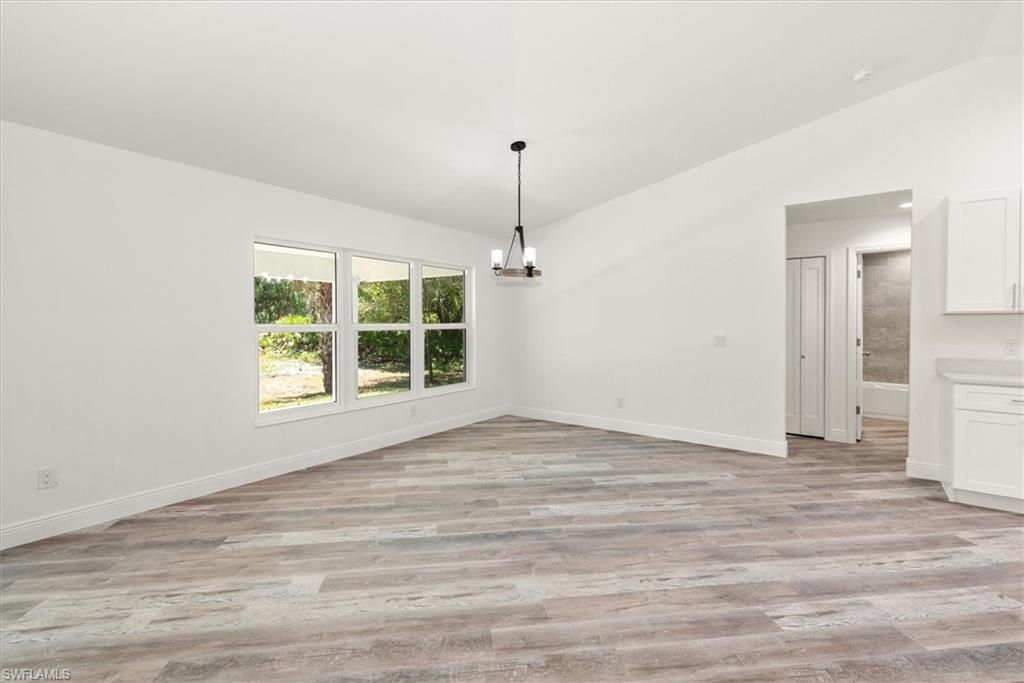 Dining view with triple windows to give a great view of the back lanai. Perfect view of a future pool area too.