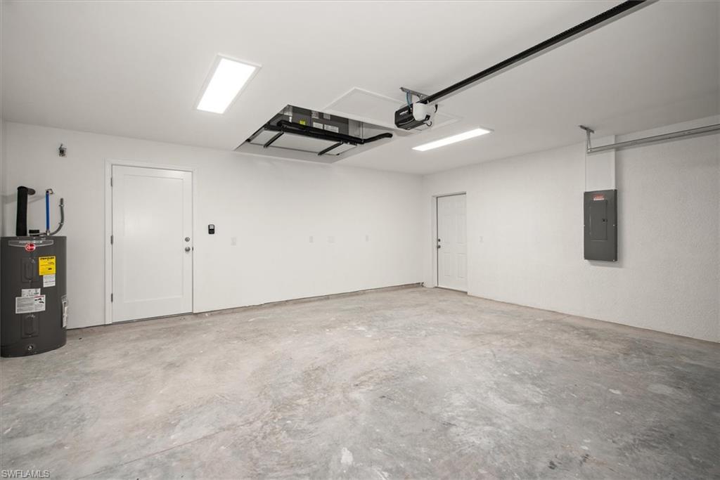 The garage is 20 x 22 which you will notice the HVAC system is recessed in the ceiling to keep it out of the way giving more space in the garage and easy access for maintenance. The side door is nice to have as well for easy access and increase the airflow when you need some fresh air.