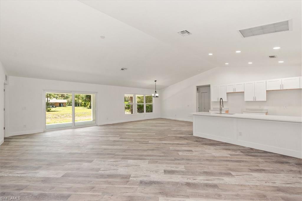 View from the entry which boasts vaulted ceilings and a excellent open floor plan.