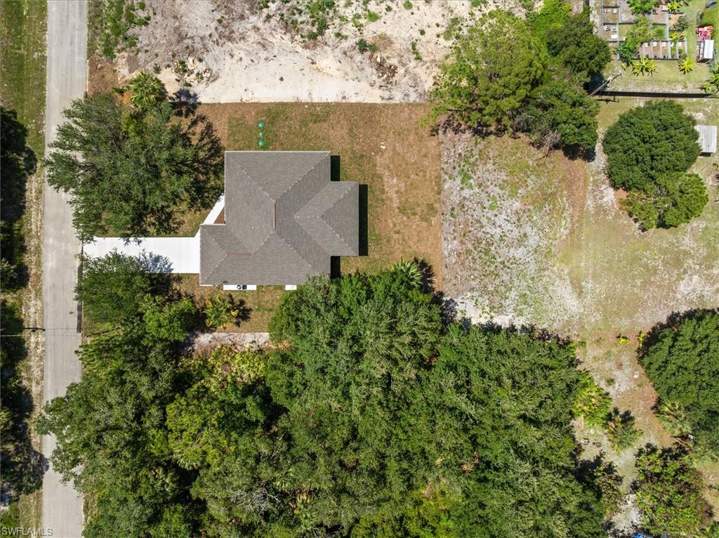 Drone view over roof. Notice all roof slopes are gable free giving you a hip roof design which is preferred by Florida Insurance Companies to give lower rates.