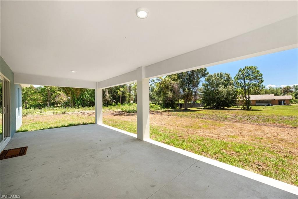 Rear lanai measures 28 x 12. Perfect set up to add a pool and have a place to get some shade or enjoy a nice lunch. The rear of the property is already cleared so this will save you some money if you want to add more structures or a pool.