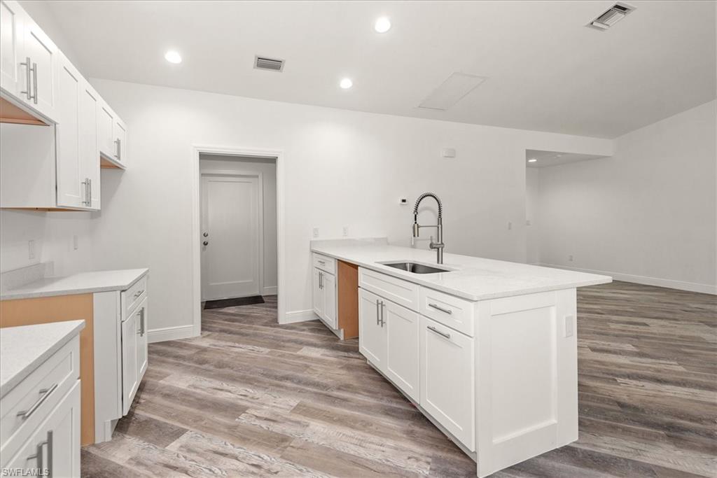 The kitchen pass through to the laundry room has a pocket door that stays hidden when not in use.