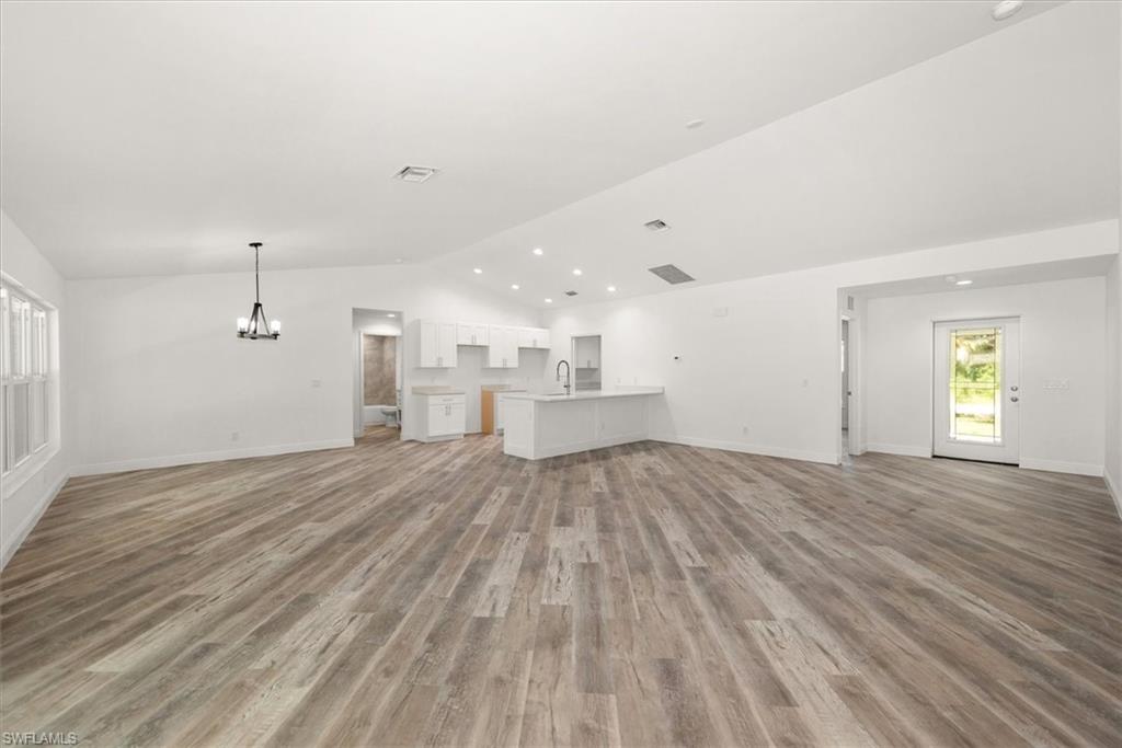 This view is from the rear sliders. Notice there is a bedroom just off the front entry that is seperate from all the other rooms. Perfect for a kids playroom or an office.