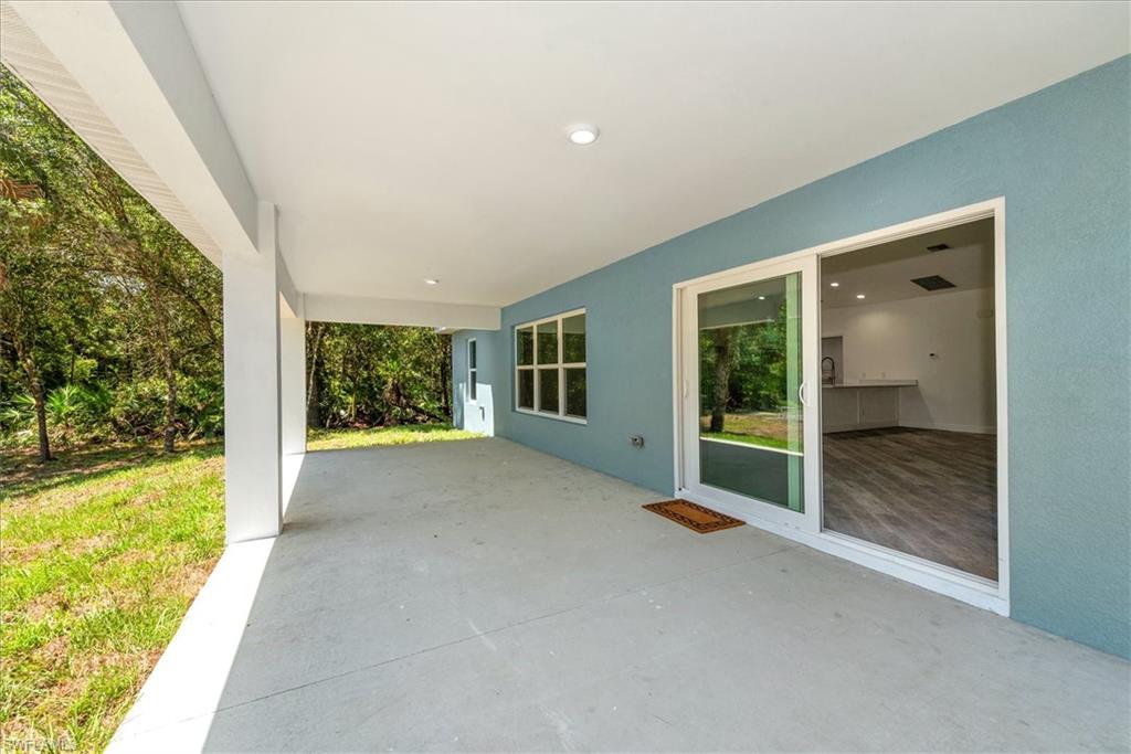 Another view of the large rear lanai 28 x 12. The triple windows is where the dining area is located. All the windows are impact double pane insulated glass. So optimal storm protection without the need for shutters.