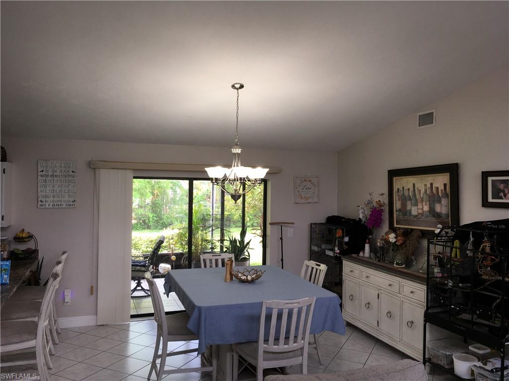 Sliding glass doors opening to a screened outdoor area