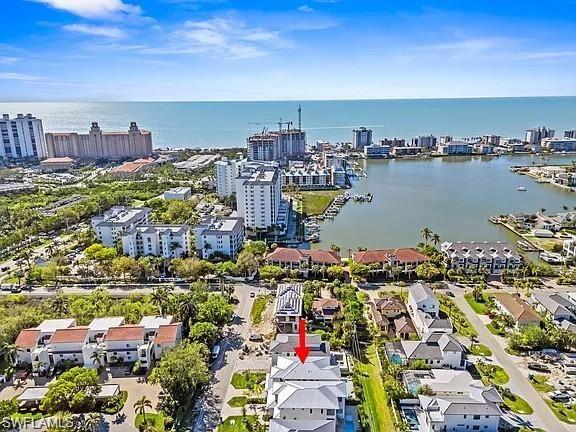 Coastal community featuring a prominent body of water, extensive shoreline, and a variety of architectural styles