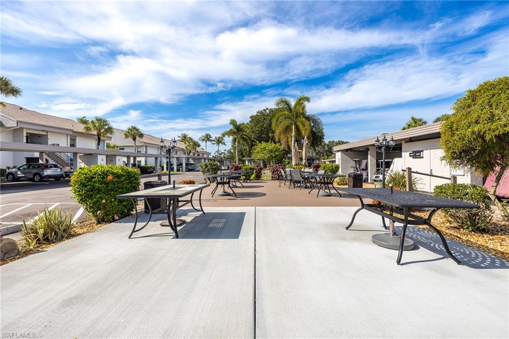 Outdoor seating area featuring concrete pavers and a paved patio