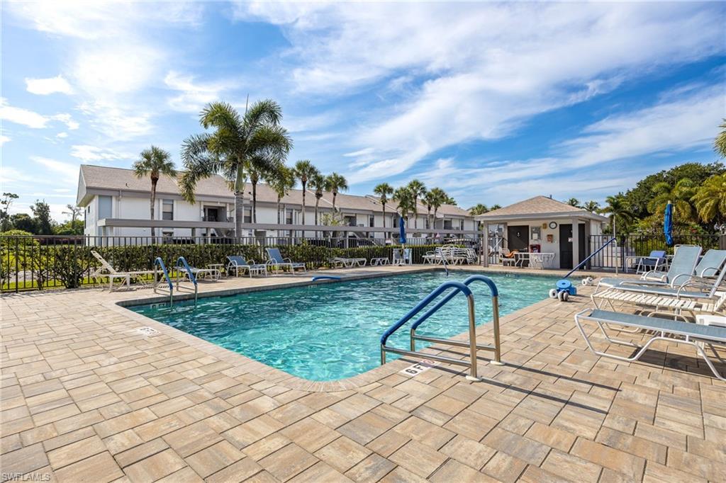 Rectangular swimming pool with integrated steps and a surrounding paver deck