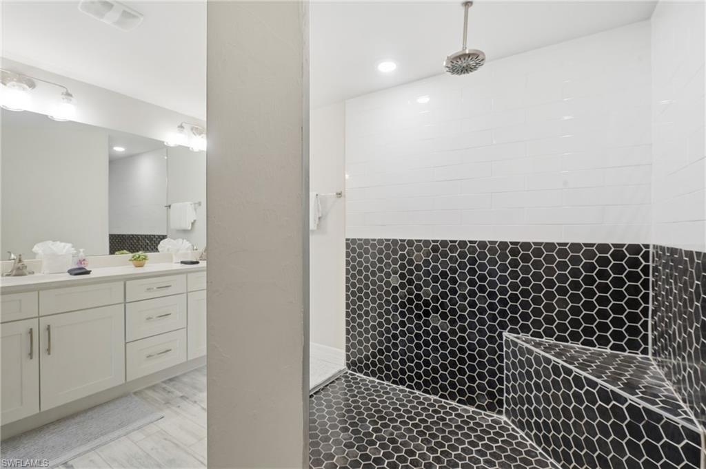 Spacious Rainshower  with black hexagonal tiling
