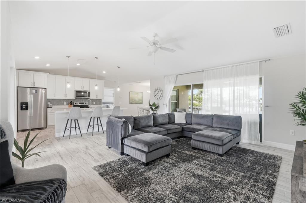 Open-concept living space featuring wood-finish flooring