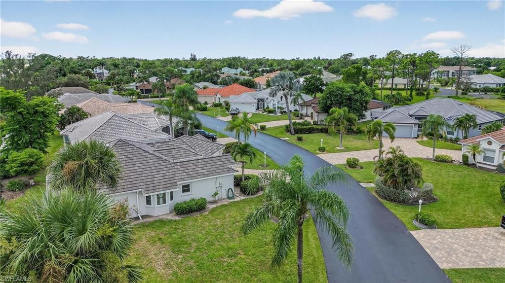 Residential neighborhood featuring paved streets and mature landscaping