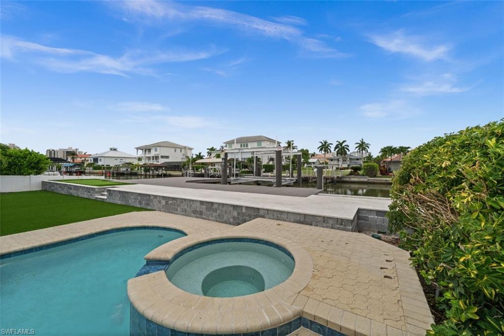 pool, boat dock, and putting green