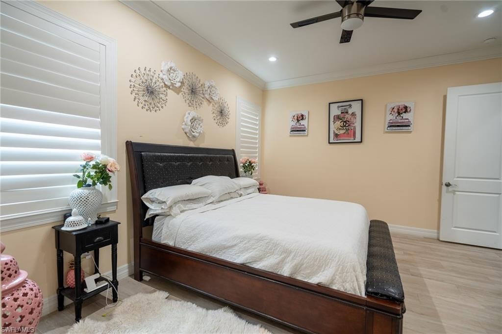 Master bedroom, tile flooring, recessed lighting, and a ceiling fan