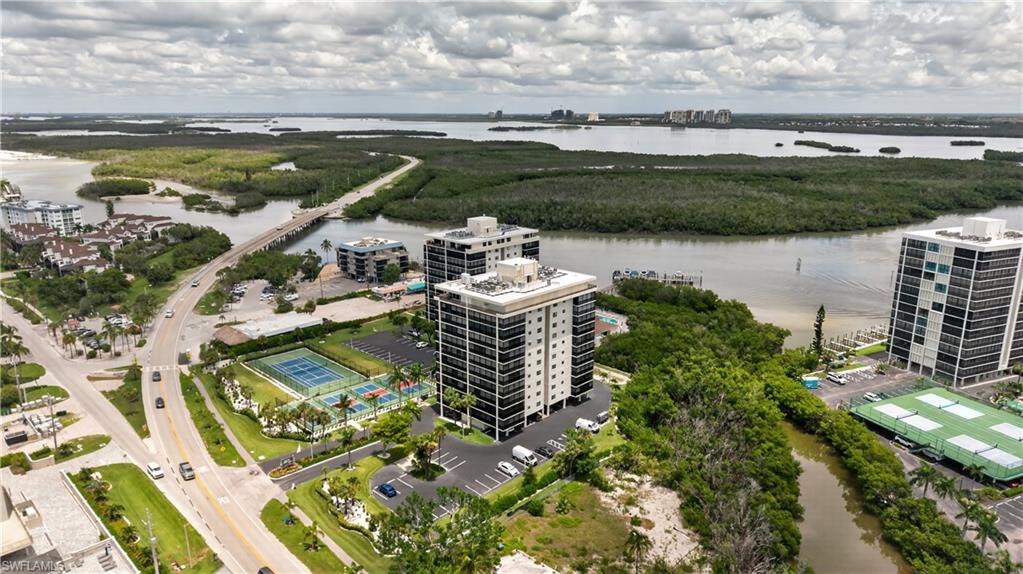 Surrounded with lush landscaping, plenty of visitor parking, pickleball courts, pool, and docks.