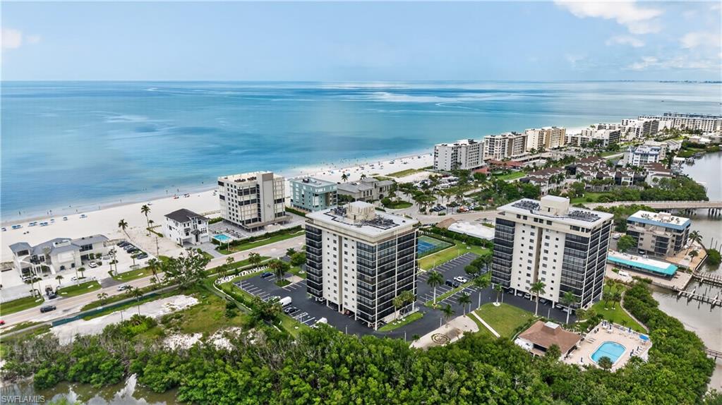 The Perfect Location surrounded by Beach, bay, and lush landscaping!