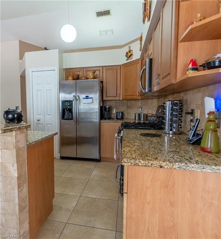 Kitchen featuring light tile patterned flooring, open shelves, tasteful backsplash, appliances with stainless steel finishes, and visible vents