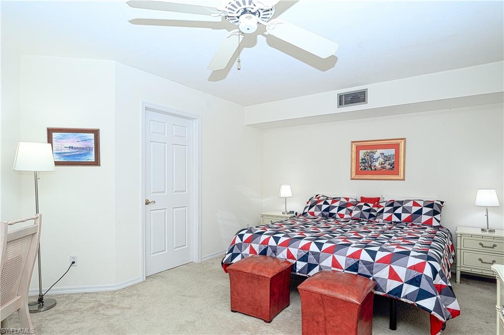 Carpeted bedroom.  leather stools no longer there