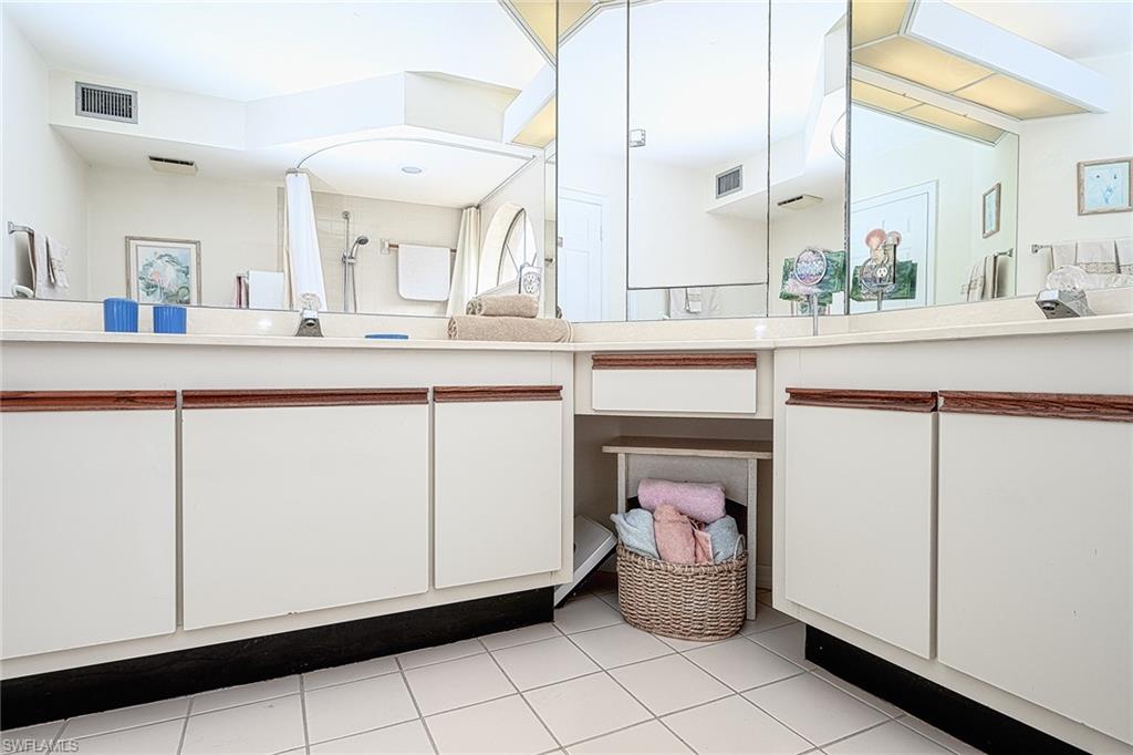 Bathroom with tile patterned flooring and vanity
