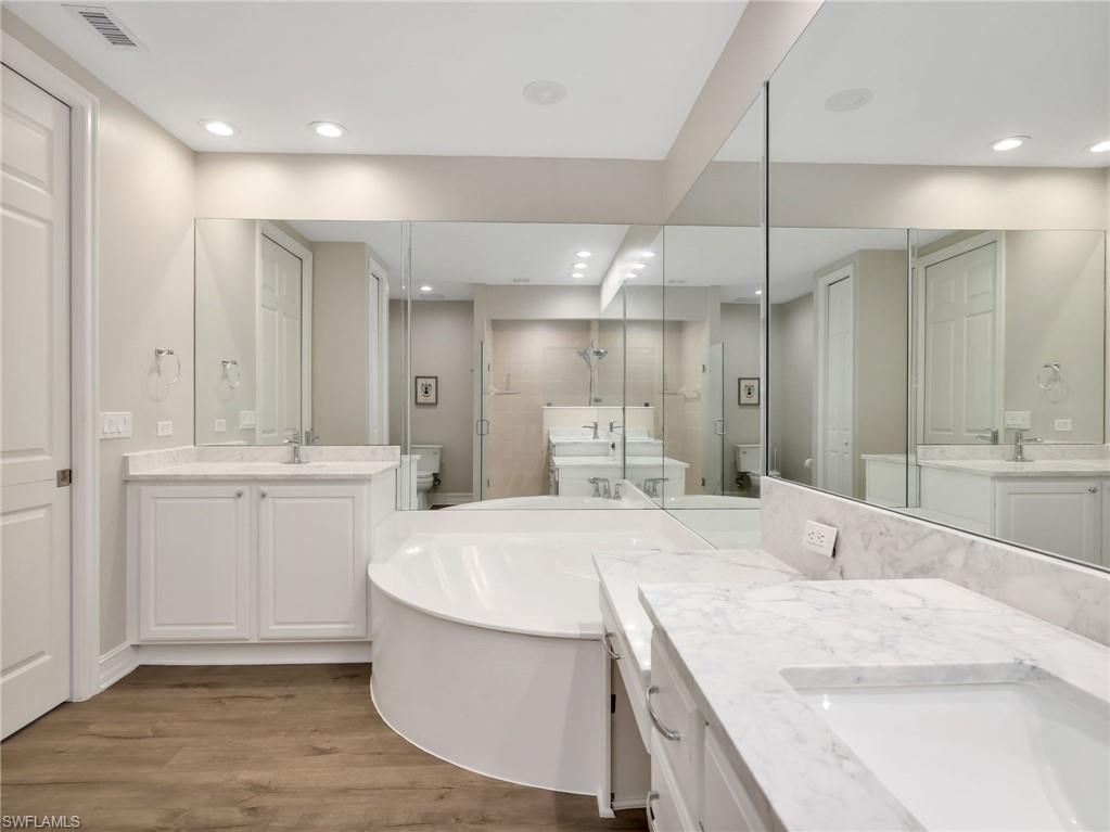 Dual sinks with new counter tops and newly epoxy tub