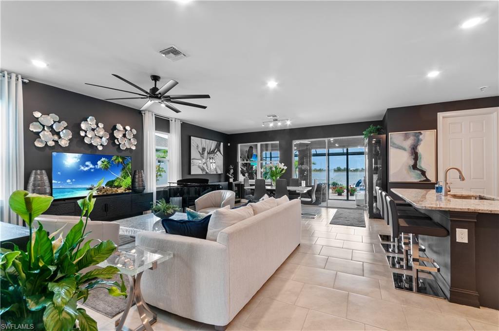 Open-concept interior featuring light tile flooring throughout