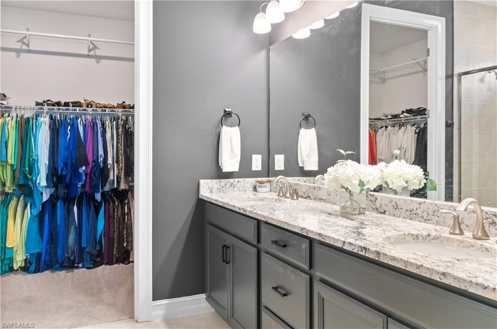 Double vanity with granite-style countertop and dual undermount sinks