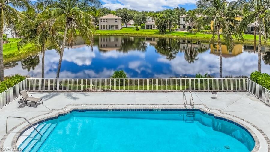 Outdoor swimming pool with integrated steps, surrounded by a concrete patio
