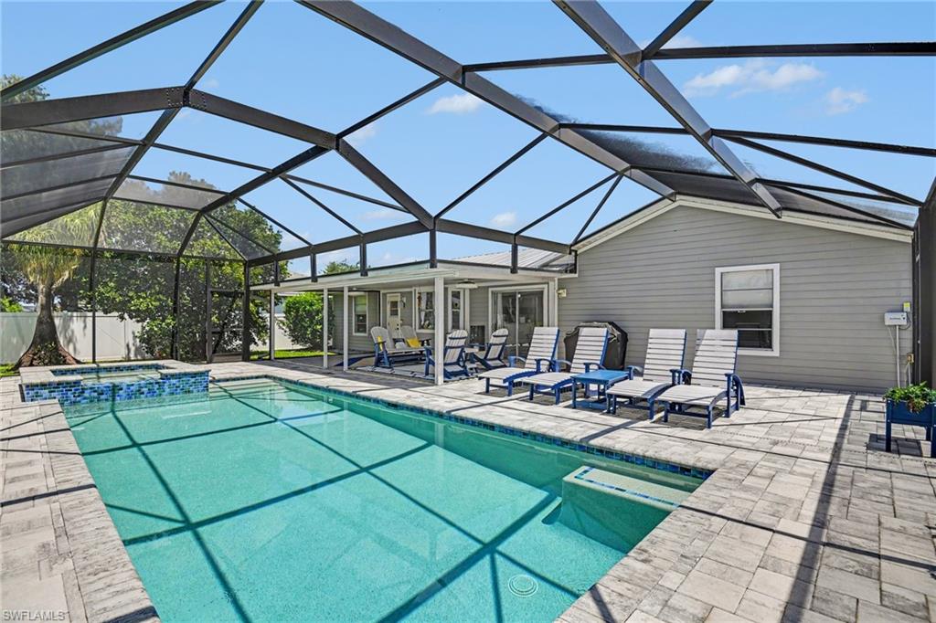 Lots of comfortable lanai seating for pool day relaxation.