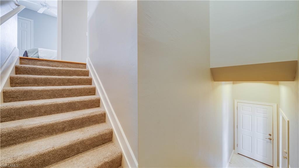 Stairs up to Home, Garage door to the right