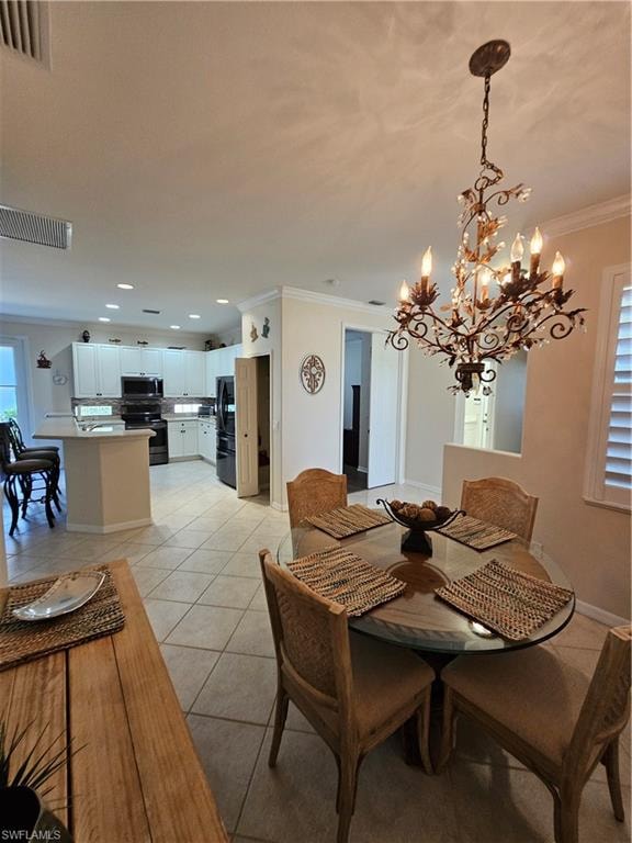Dining area with crown molding, a chandelier, and light tile patterned floors