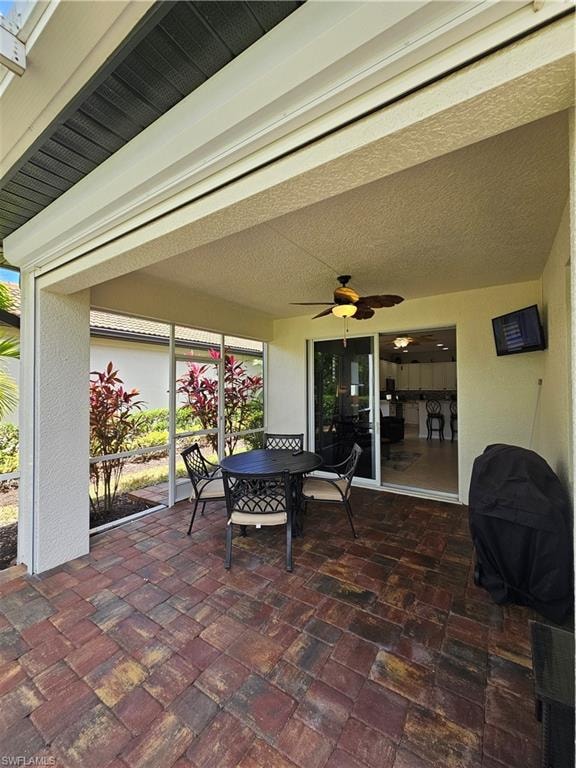 View of patio / terrace with ceiling fan and outdoor dining area