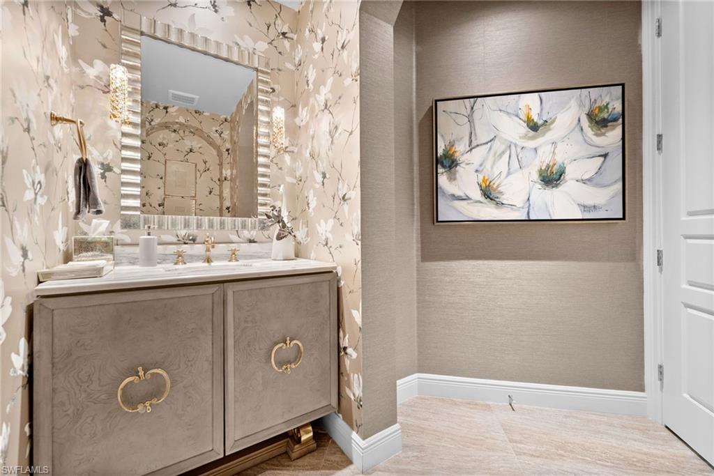 Bathroom featuring vanity and baseboards