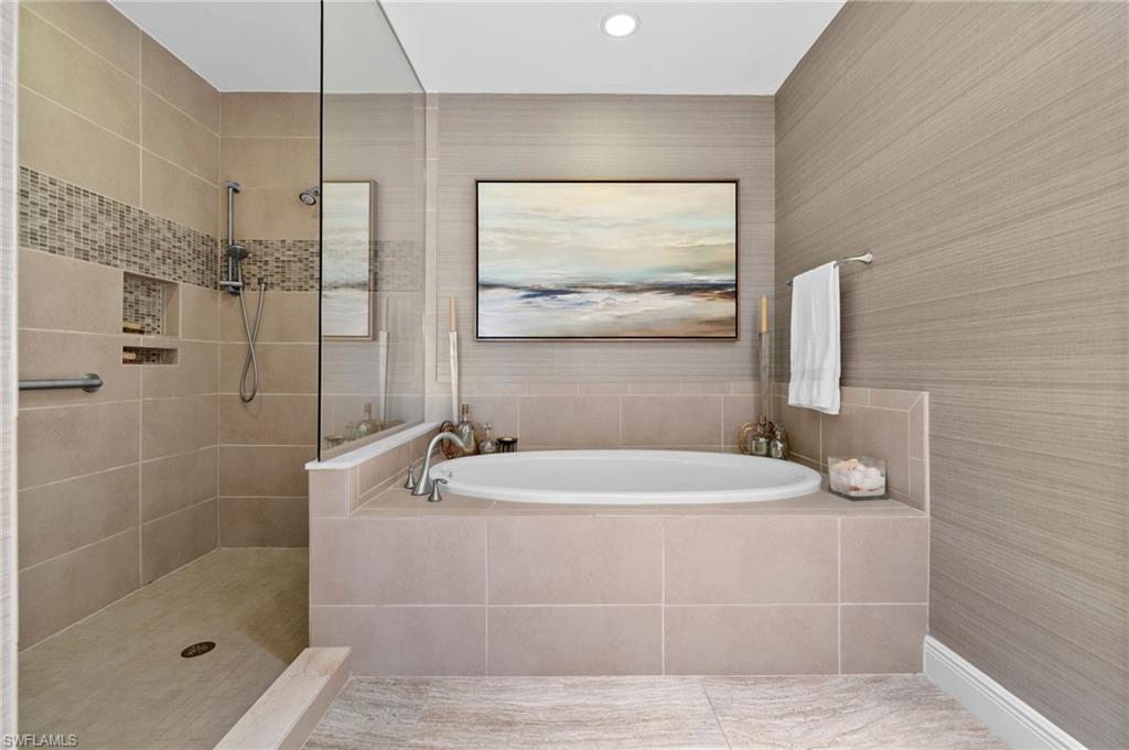 Bathroom with a garden tub, walk in shower, and recessed lighting