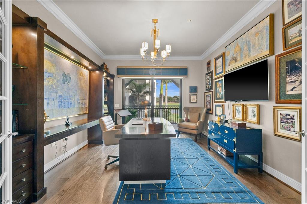 Office space with wood finished floors, a chandelier, and ornamental molding