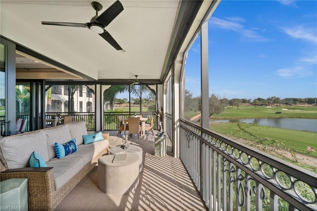 Sunroom featuring an outdoor living space, ceiling fan, a water view, golf course view, and healthy amount of natural light